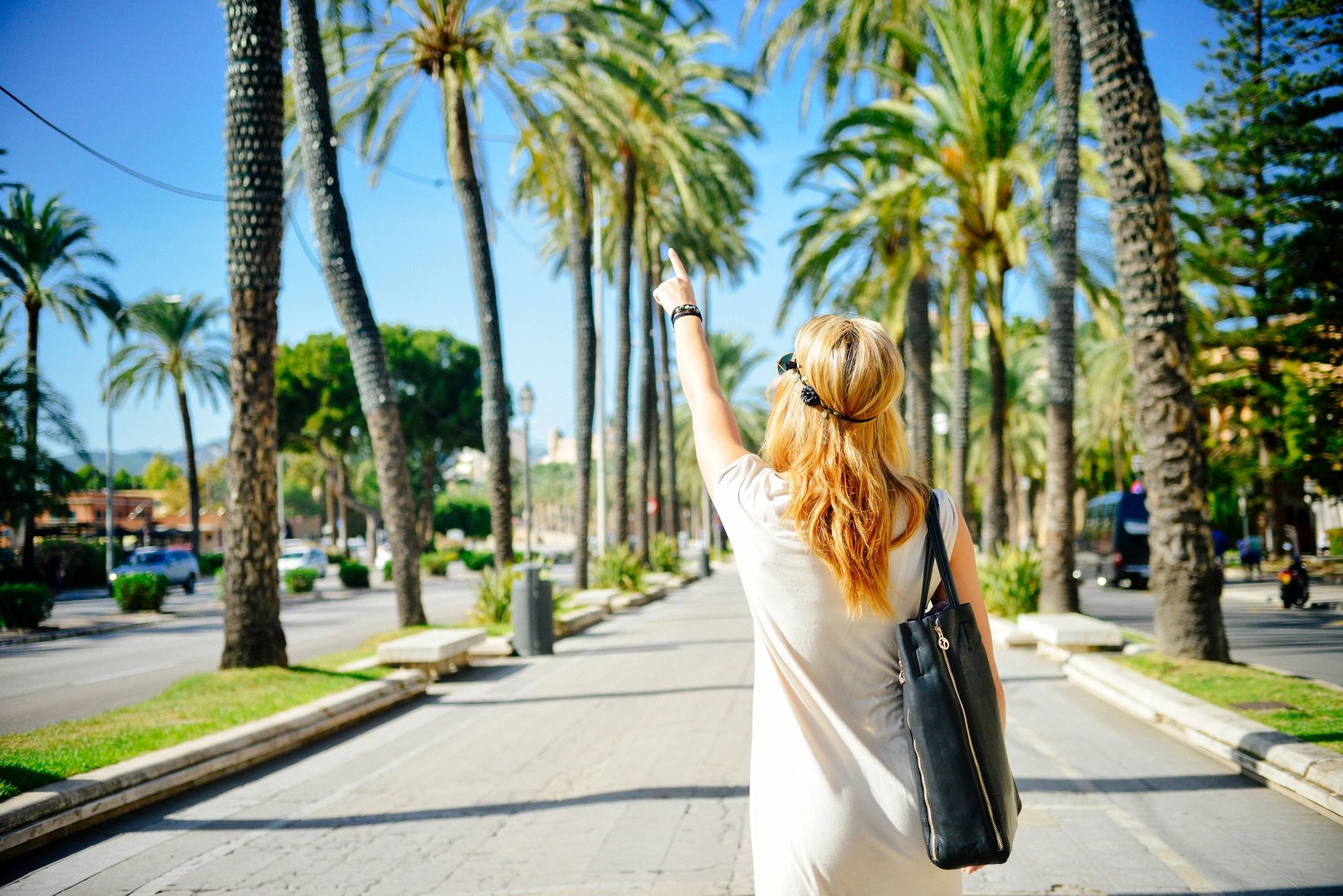 woman pointing to the sky